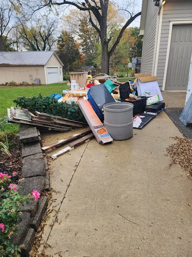 Dumpster being loaded with debris for Commercial Dumpster Rental in New London
